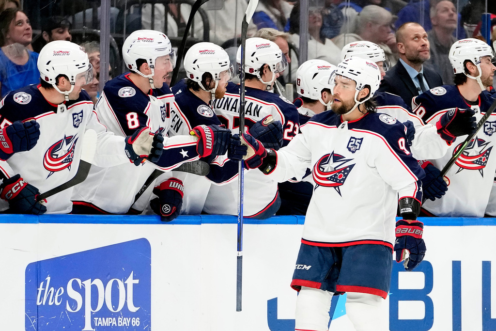 Columbus Blue Jackets defenseman Ivan Provorov (9) celebrates with the bench after scoring against the Tampa Bay Lightning during the second period of an NHL hockey game Tuesday, March 10, 2026, in Tampa, Fla. (AP Photo/Chris O'Meara)