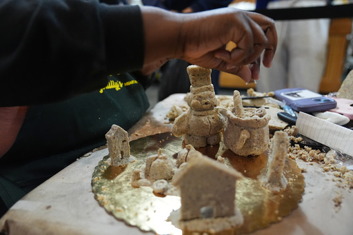 Toni Lee works on her entry to Scrapple Sculpting Contest at the Reading Terminal Market in Philadelphia, Friday, Oct. 10, 2025. (AP Photo/Matt Rourke) Toni Lee works on her entry to Scrapple Sculpting Contest at the Reading Terminal Market in Philadelphia, Friday, Oct. 10, 2025. (AP Photo/Matt Rourke)