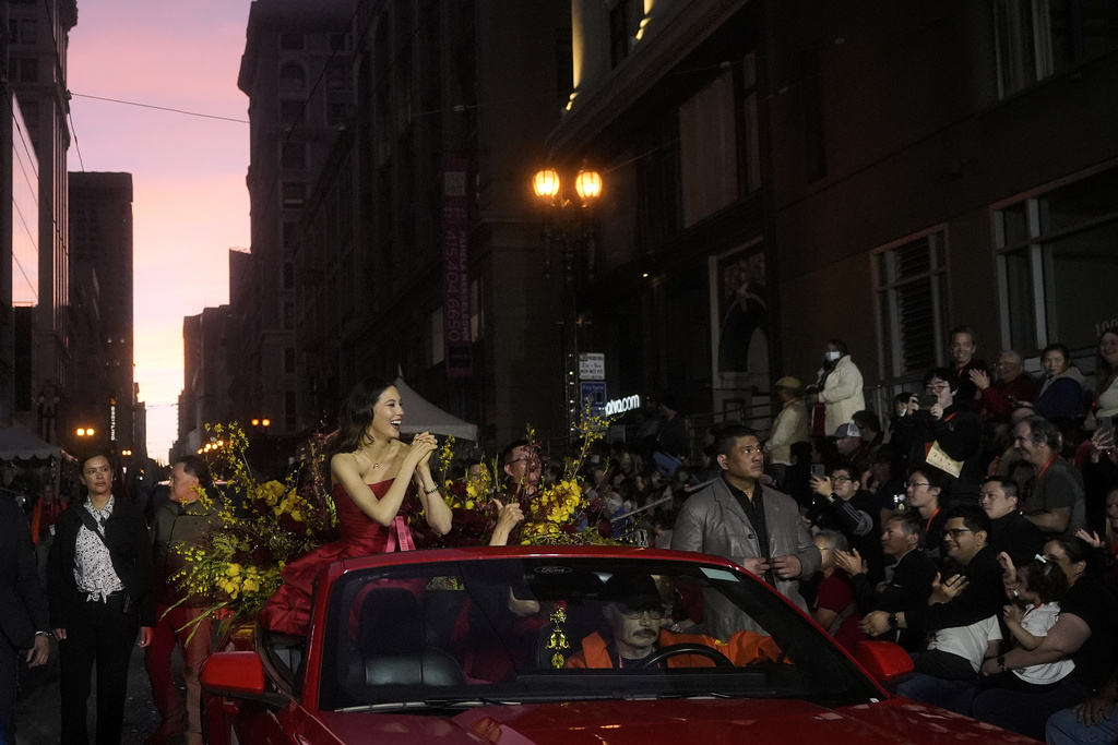 Olympic gold medalist and Grand Marhsal Eileen Gu, middle left, gestures during the Chinese New Year Parade in San Francisco, Saturday, March 7, 2026. (AP Photo/Jeff Chiu)