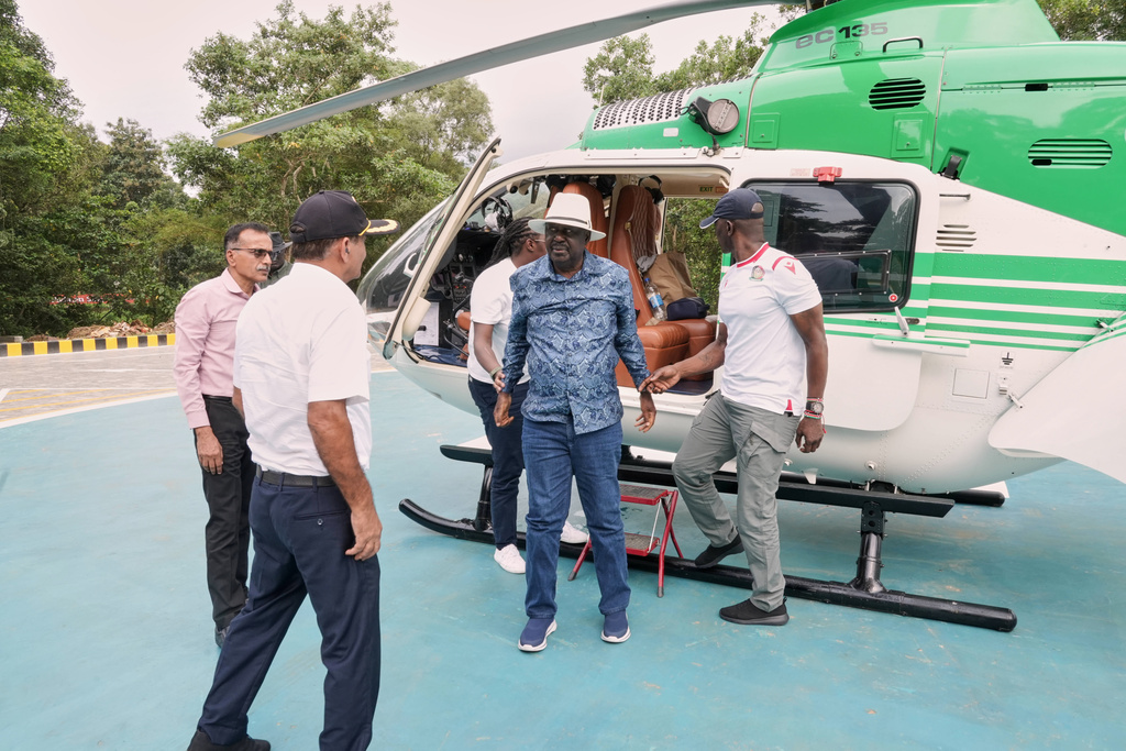 Former Kenyan Prime Minister Raila Odinga, center in blue, arrives at the Sreedhareeyam Ayurvedic hospital in Koothattukulam, Kerala, India, Friday, Oct.10, 2025. (AP Photo/Manu.K.S)