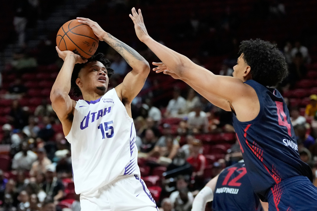 Utah Jazz's Trey Alexander shoots over LA Clippers' Kobe Sanders during the second half of an NBA Summer League basketball game Sunday, July 12, 2026, in Las Vegas. (AP Photo/John Locher)