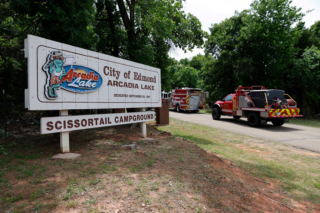 Edmond fire crews enter Scissortail Campground at Arcadia Lake in Edmond, Okla. on Monday, May 4, 2026 after a party shooting on Sunday evening. (AP Photo/Alonzo Adams)