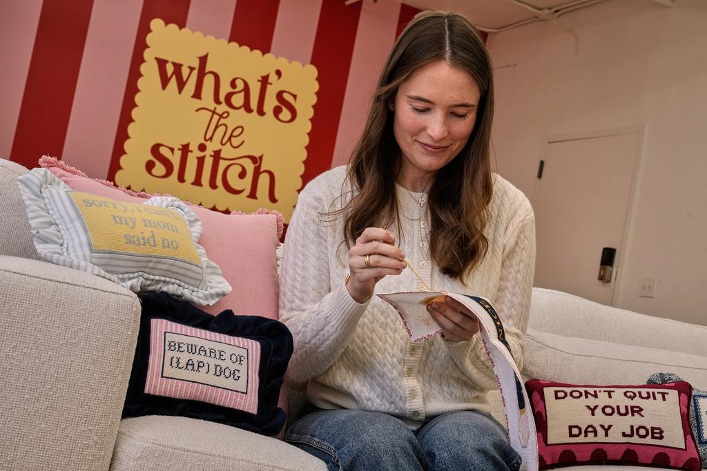 Emma MacTaggart, founder of What's the Stitch needlepoint business, is photographed in her studio, in New York, Monday, Feb. 9, 2026. (AP Photo/Richard Drew)