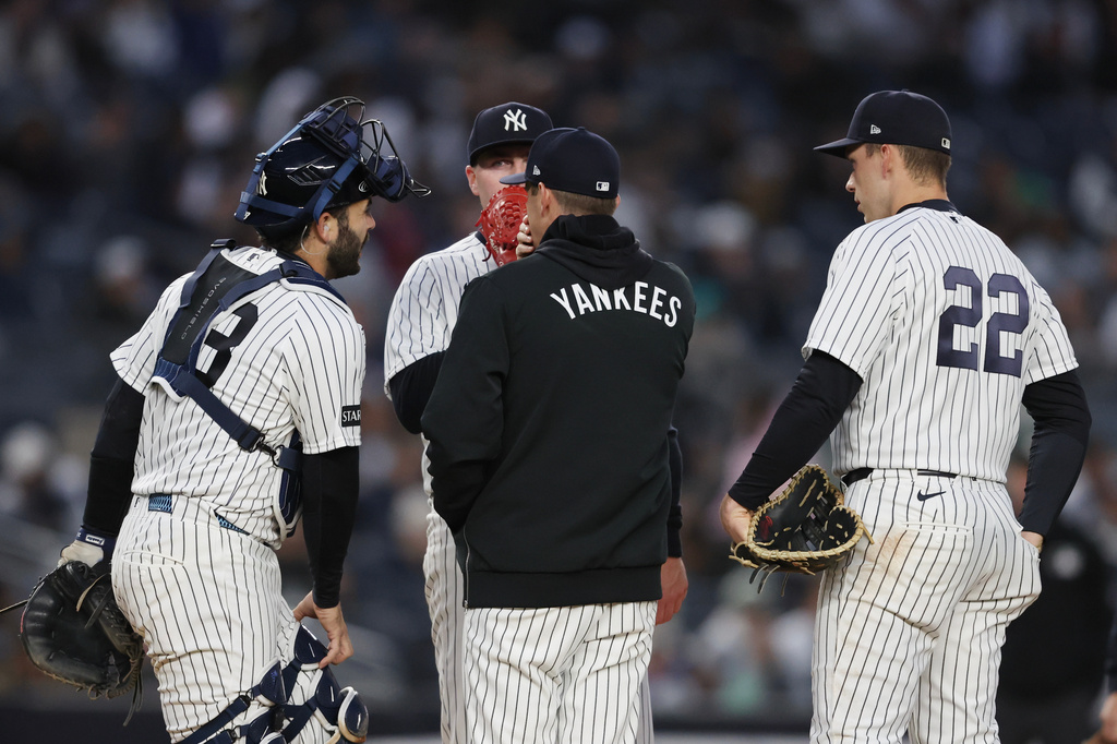 New York Yankees pitcher Ryan Weathers gets a visit on the mound during the first inning of a baseball game against the Miami Marlins, Saturday, April 4, 2026, in New York. (AP Photo/Heather Khalifa)