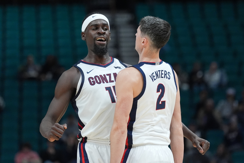 Gonzaga forward Graham Ike (15) celebrates a score with teammate Steele Venters (2) during the first half of an NCAA college basketball game against Maryland in the Players Era tournament Las Vegas, Tuesday, Nov. 25, 2025. (AP Photo/Eric Gay)