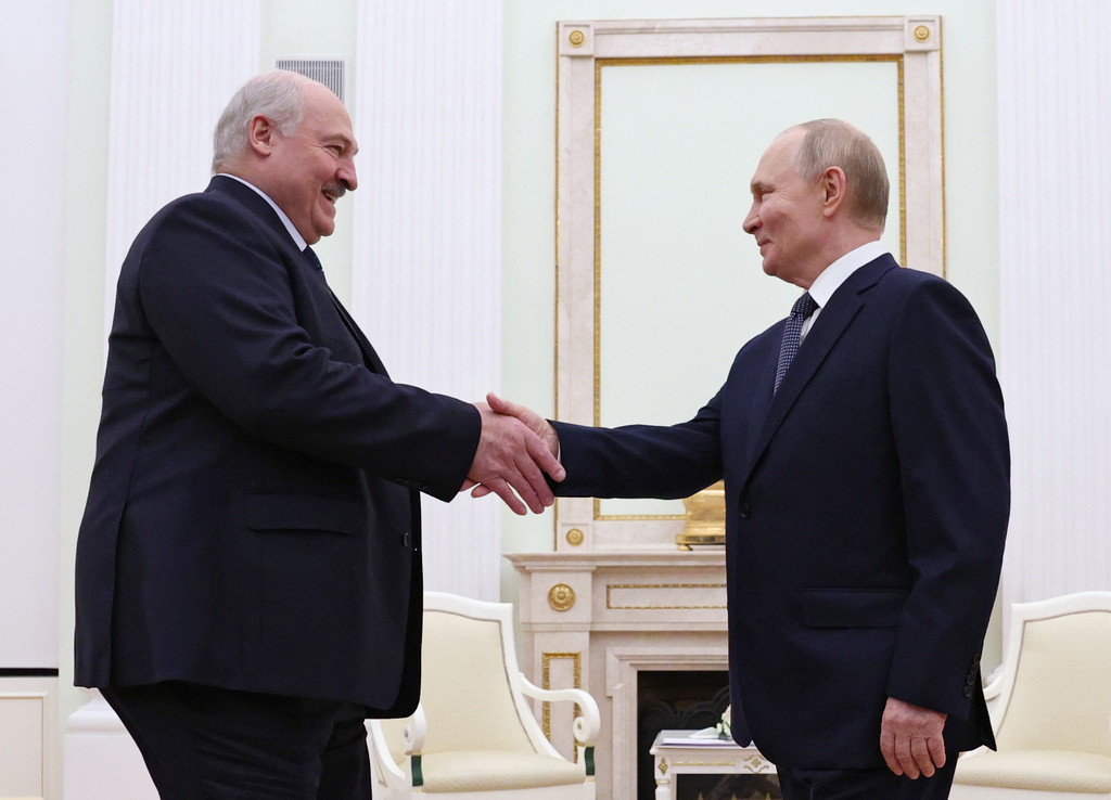 Russian President Vladimir Putin, right, and Belarusian President Alexander Lukashenko shake hands during their meeting a the Kremlin in Moscow, Russia, Friday, Sept. 26, 2025. (Ramil Sitdikov/Pool Photo via AP)