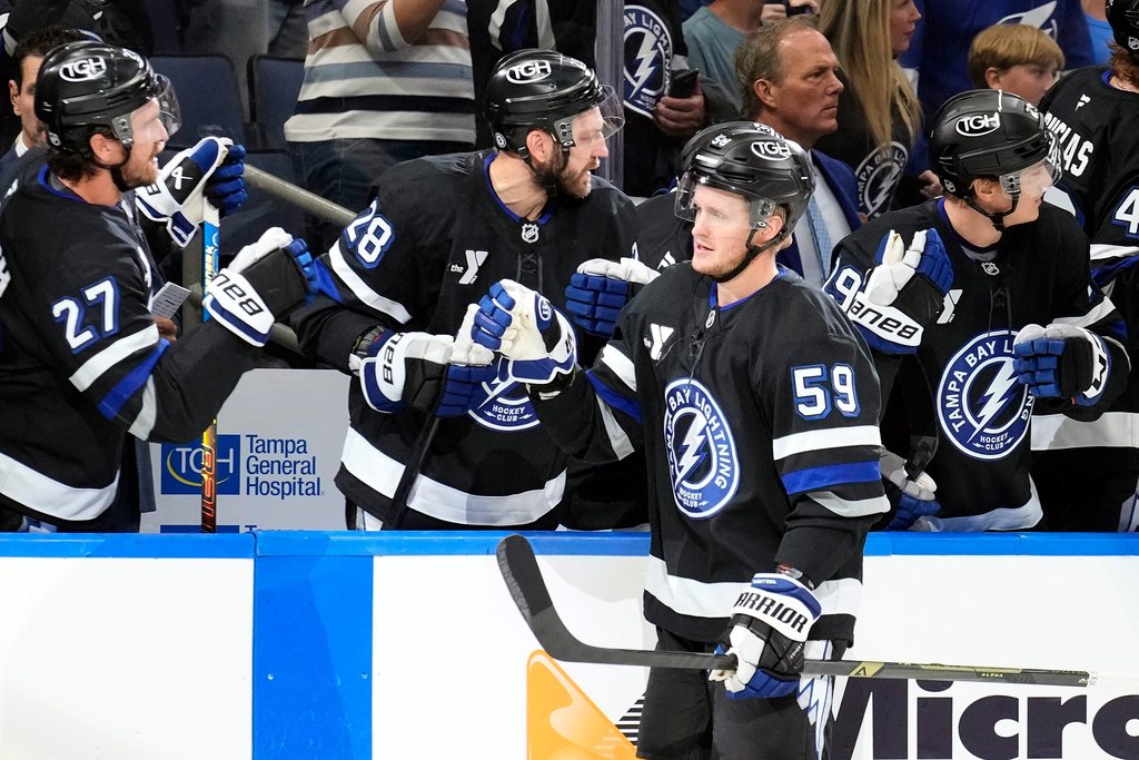 Tampa Bay Lightning center Jake Guentzel (59) celebrates with the bench after his goal against the Anaheim Ducks during the first period of an NHL hockey game Saturday, Oct. 25, 2025, in Tampa, Fla. (AP Photo/Chris O'Meara)