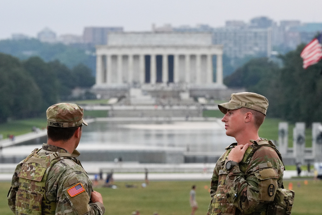 South Carolina National Guardsmen patrol at the base of the Washington Monument, Wednesday, Aug. 20, 2025, in Washington. (AP Photo/Julia Demaree Nikhinson)
