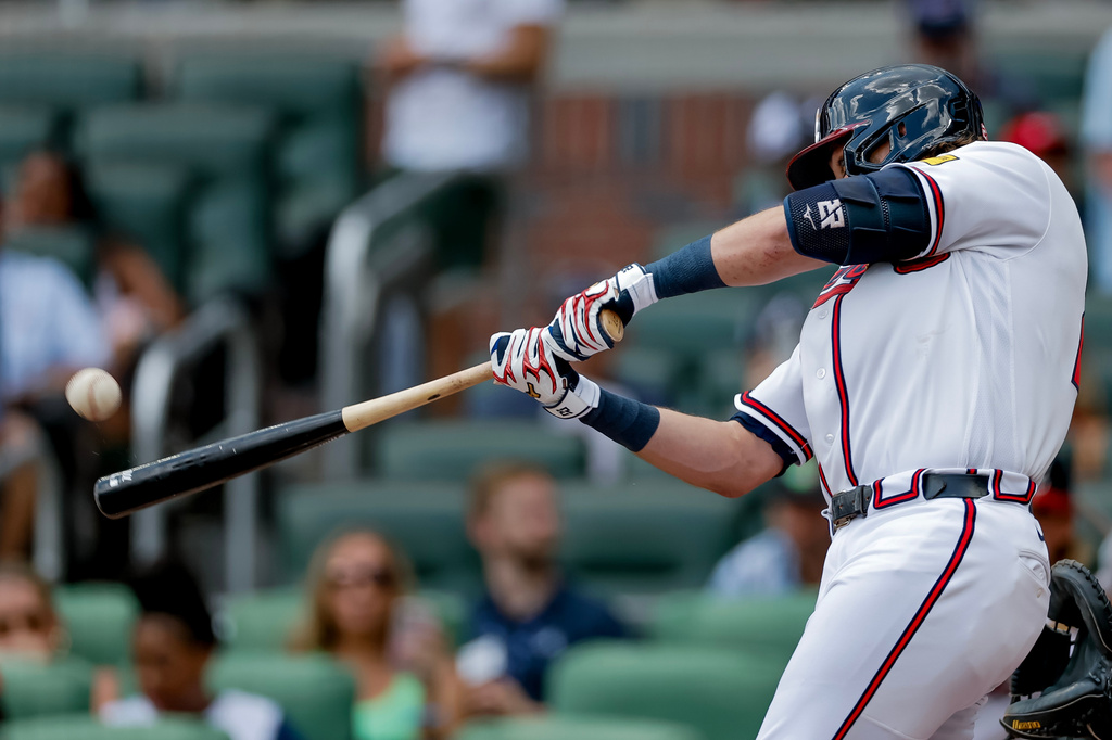 Atlanta Braves' Austin Riley hits a solo home run against the Texas Rangers during the second inning of a baseball game, Sunday, July 19, 2026, in Atlanta. (AP Photo/Erik S. Lesser)