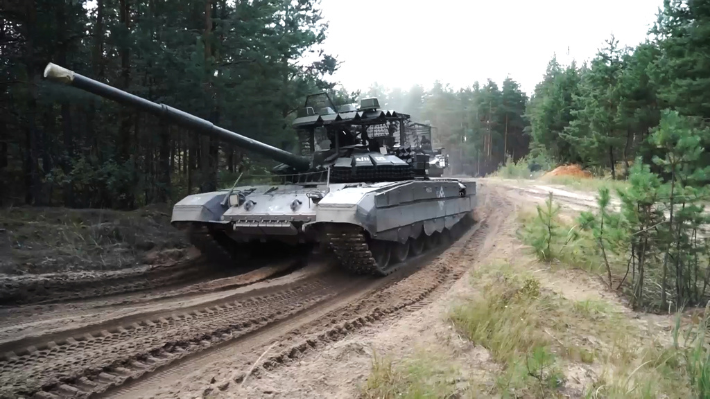 In this photo taken from video distributed by Russian Defense Ministry Press Service on Friday, Sept. 12, 2025, Armored vehicles drive during joint military drills held by Russia and Belarus. (Russian Defense Ministry Press Service via AP)