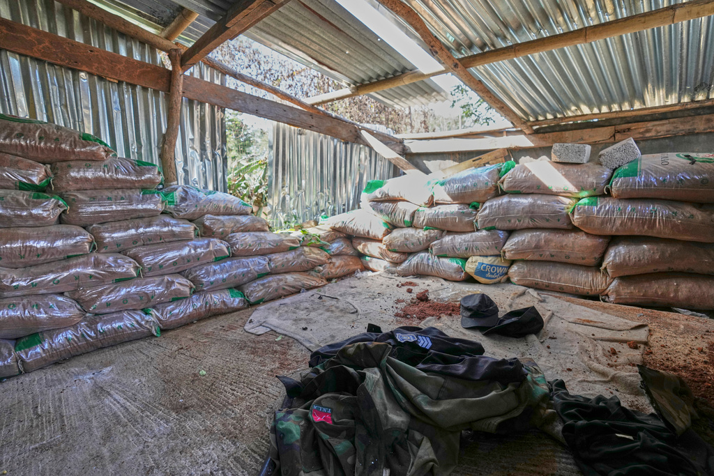 In this photo taken during a trip supervised by pro-military Myanmar media, uniforms of Ta'ang National Liberation Army (TNLA) are seen inside a police station in Kyaukme, northern Shan State, Myanmar, Friday, Oct. 10, 2025. (AP Photo/Aung Shine Oo)