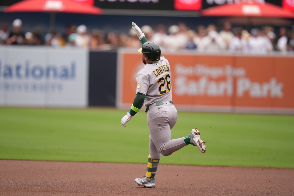 Athletics' Carlos Cortes celebrates after hitting a home run during the first inning of a baseball game against the San Diego Padres Sunday, May 24, 2026, in San Diego. (AP Photo/Gregory Bull)