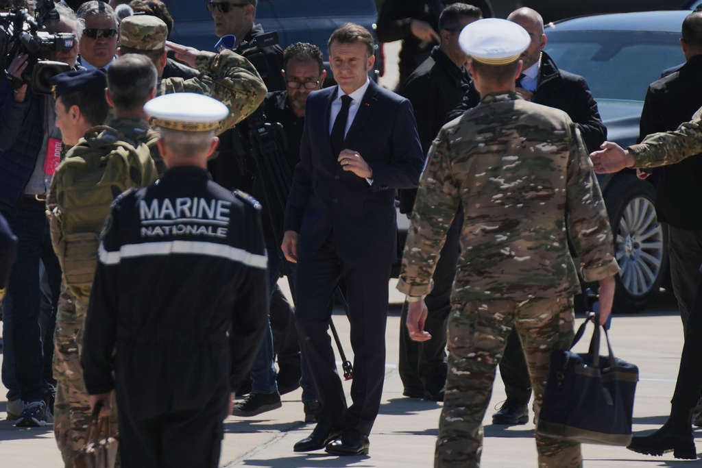 French President Emmanuel Macron arrives at Andreas Papandreou Air Base ahead of his meeting with Cyprus President Nikos Christodoulides and Greece's Prime Minister Kyriakos Mitsotakis in Paphos, Cyprus, on Monday, March 9, 2026. (AP Photo/Petros Karadjias)