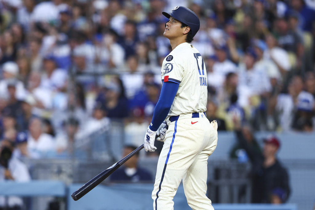 Los Angeles Dodgers' Shohei Ohtani watches his home run during the fifth inning of a baseball game against the Toronto Blue Jays, Saturday, Aug. 9, 2025, in Los Angeles. (AP Photo/Jessie Alcheh)
