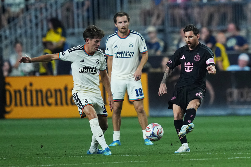 Inter Miami's Leo Messi, right, passes past Philadelphia Union's Milan Iloski, left, and Indiana Vassilev, center, during the first half of an MLS soccer match, Wednesday, Aug. 19, 2026, in Chester, Pa. (AP Photo/Matt Rourke)