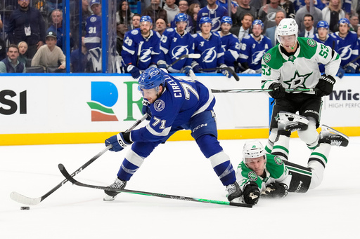 Tampa Bay Lightning center Anthony Cirelli (71) gets past Dallas Stars right wing Mikko Rantanen (96) and center Wyatt Johnston (53) on the way to scoring the game-winning goal during overtime an NHL hockey game Thursday, Oct. 30, 2025, in Tampa, Fla. (AP Photo/Chris O'Meara) Tampa Bay Lightning center Anthony Cirelli (71) gets past Dallas Stars right wing Mikko Rantanen (96) and center Wyatt Johnston (53) on the way to scoring the game-winning goal during overtime an NHL hockey game Thursday, Oct. 30, 2025, in Tampa, Fla. (AP Photo/Chris O'Meara)