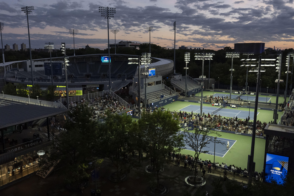 Shielded LED lights shine over the tennis courts during the U.S. Open tennis championships at the USTA Billie Jean King National Tennis Center, Tuesday, Aug. 19, 2025, in New York. (AP Photo/Yuki Iwamura)