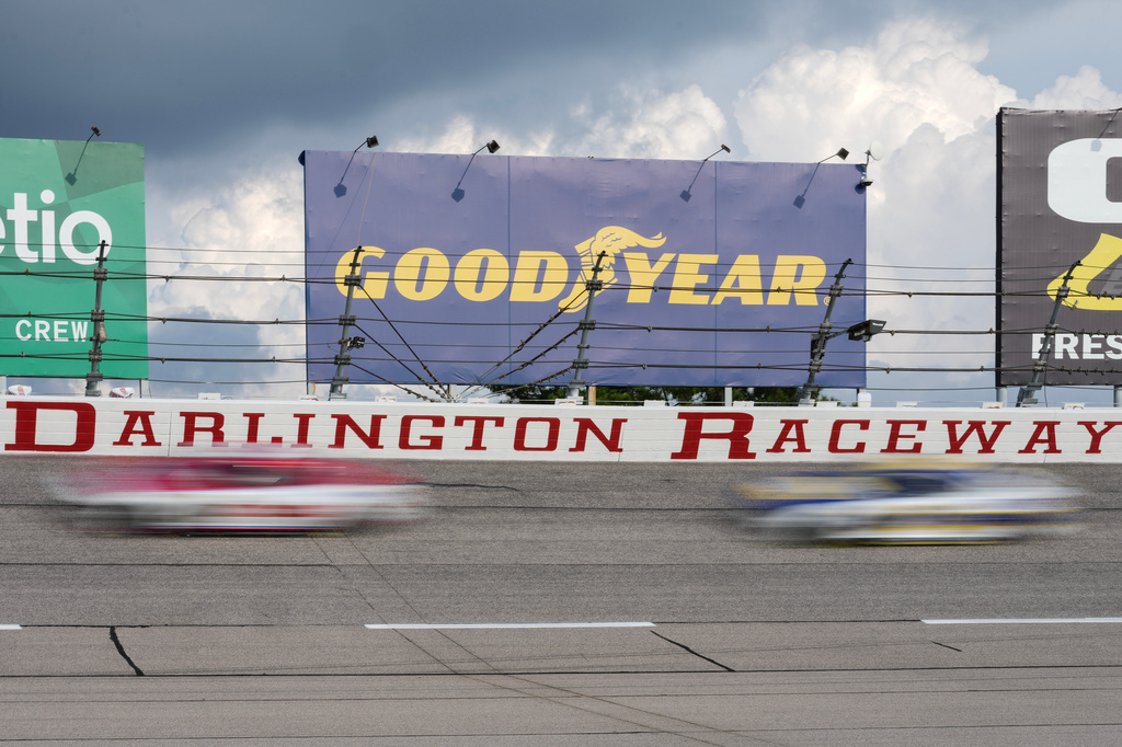 Drivers compete through Turn 2 during a NASCAR Cup Series auto race at Darlington Raceway, Sunday, Sept. 6, 2026, in Darlington, S.C. (AP Photo/Matt Kelley)
