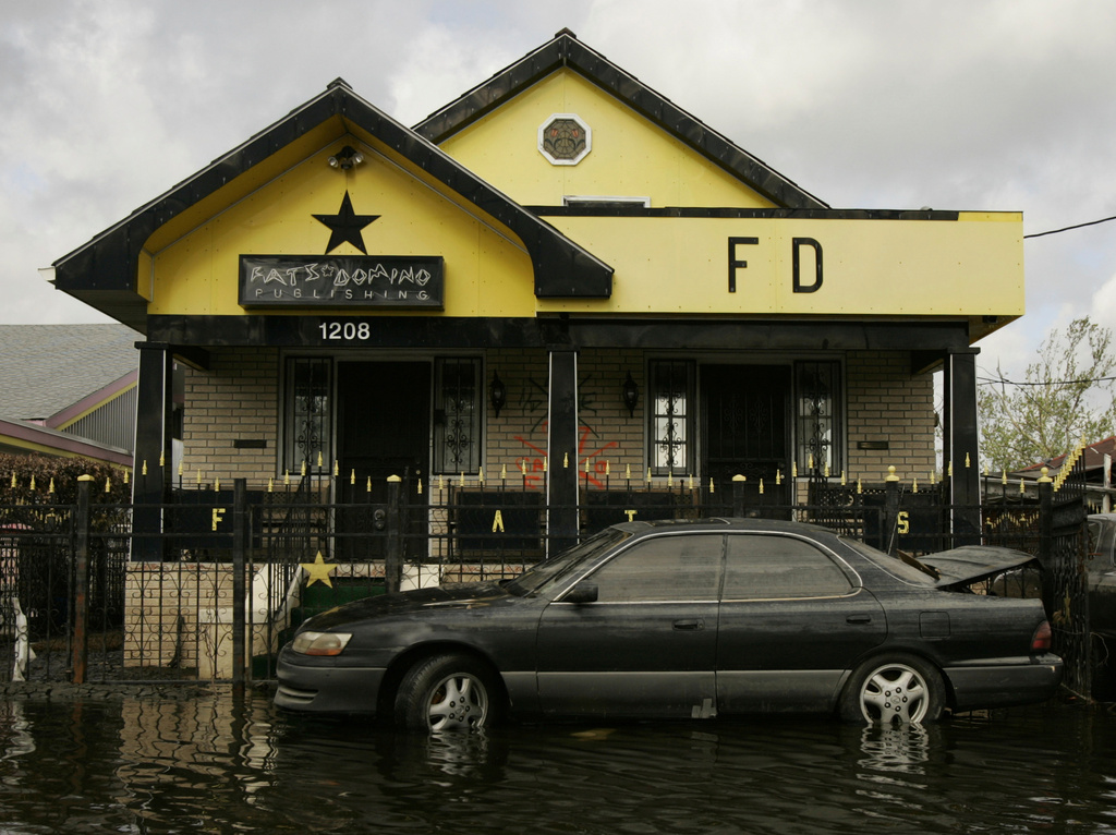 FILE - The house belonging to musician Fats Domino, a landmark in the Lower Ninth Ward, is flooded a second time on Sept. 25, 2005, in New Orleans. (AP Photo/Kevork Djansezian, File)