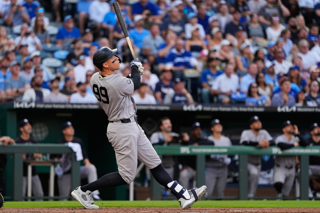 New York Yankees' Aaron Judge watches his sacrifice fly to score a run during the fourth inning of baseball game against the Kansas City Royals, Wednesday, May 27, 2026, in Kansas City, Mo. (AP Photo/Charlie Riedel)