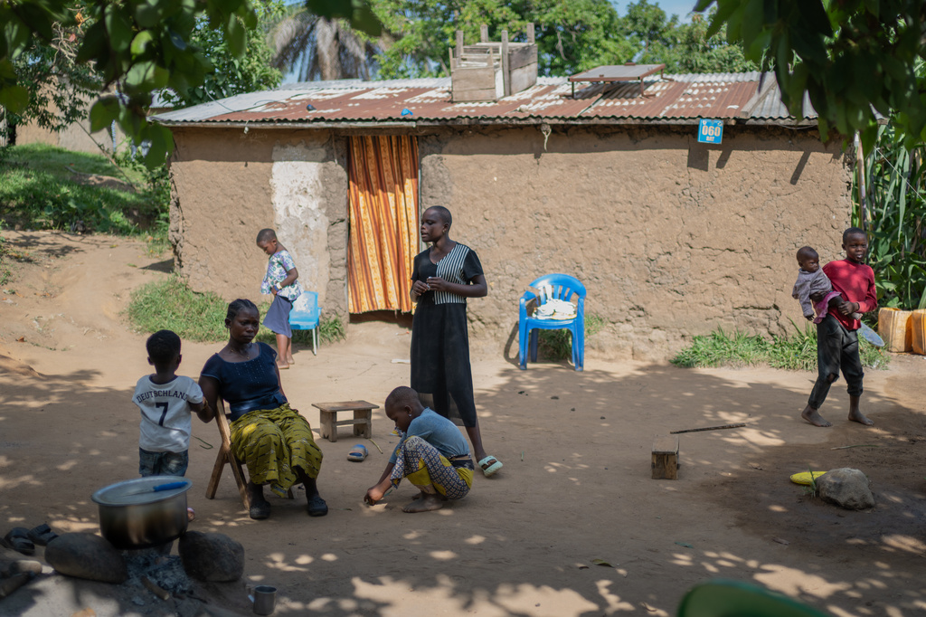 Abigaelle Mbusi, 30, a resident skeptical about Ebola, spends time with her family at their home in Bunia, Congo, Thursday, June 4, 2026. (AP Photo/Moses Sawasawa)