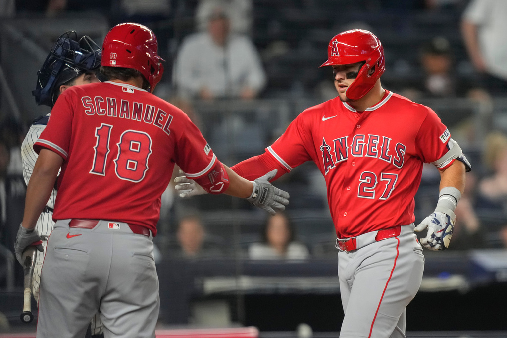 Los Angeles Angels' Mike Trout (27) celebrates with Nolan Schanuel (18) after hitting a two-run home run during the eighth inning of a baseball game against the New York Yankees, Monday, April 13, 2026, in New York. (AP Photo/Yuki Iwamura)