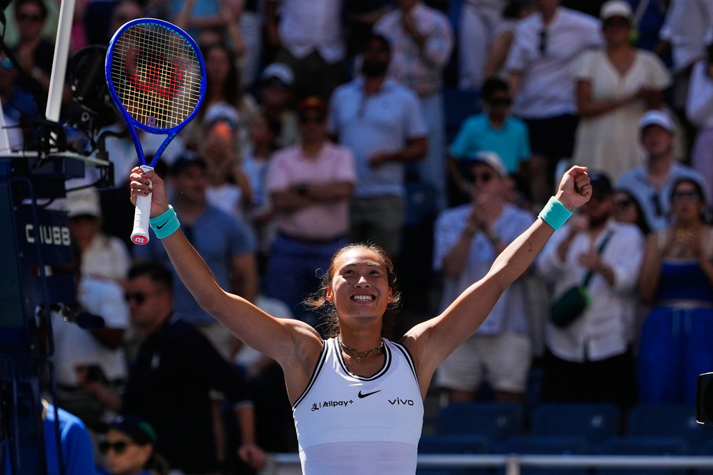 Qinwen Zheng, of China, celebrates after winning a match against Iga Swiatek, of Poland, during the fourth round of the U.S. Open tennis championships, Monday, Sept. 7, 2026, in New York. (AP Photo/Seth Wenig)
