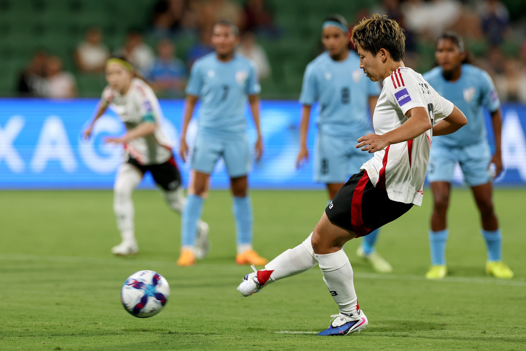 Japan's Kiko Seike scores from the penalty spot during the Women's Asian Cup soccer match between Japan and India in Perth, Australia, Saturday, March 7, 2026. (Colin Murtyt/AAPImage via AP)