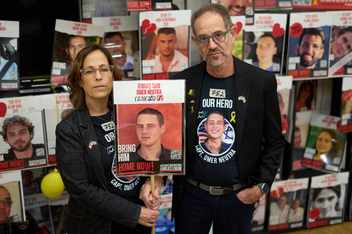 Ronen and Orna Neutra, parents of Omer Neutra, a U.S.-Israeli citizen who was killed in the Hamas-led attacks on Oct. 7, 2023, present a photo of their son in Tel Aviv, Israel, Monday, Oct. 27, 2025. (AP Photo/Ariel Schalit) Ronen and Orna Neutra, parents of Omer Neutra, a U.S.-Israeli citizen who was killed in the Hamas-led attacks on Oct. 7, 2023, present a photo of their son in Tel Aviv, Israel, Monday, Oct. 27, 2025. (AP Photo/Ariel Schalit)