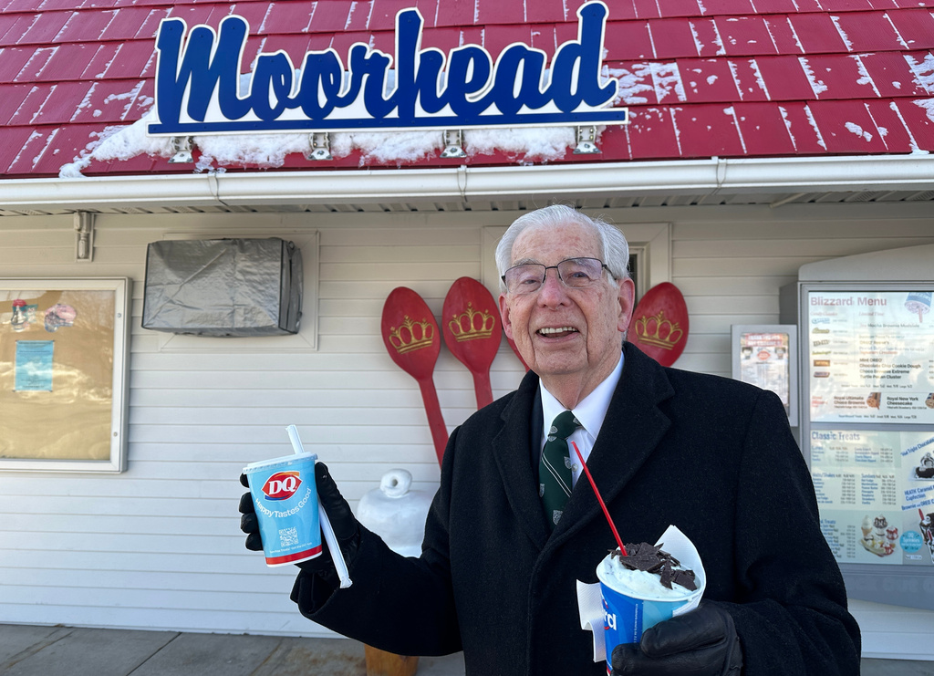 Jerry Protextor heads to his car with ice cream treats for his wife and him Sunday, March 1, 2026, at the Dairy Queen in Moorhead, Minn. (AP Photo/Jack Dura)
