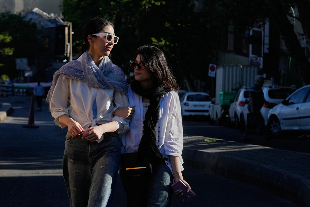 Women walk in northern Tehran, Iran, Sunday, May 10, 2026. (AP Photo/Vahid Salemi)