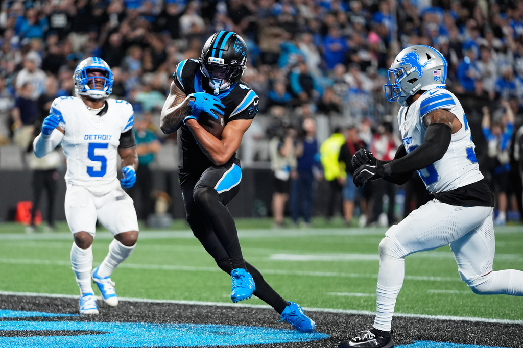 Carolina Panthers wide receiver Tetairoa McMillan (4) scores a touchdown during an NFL football game against the Detroit Lions in Charlotte, N.C., Sunday, Oct. 4, 2026. (AP Photo/Erik Verduzco)