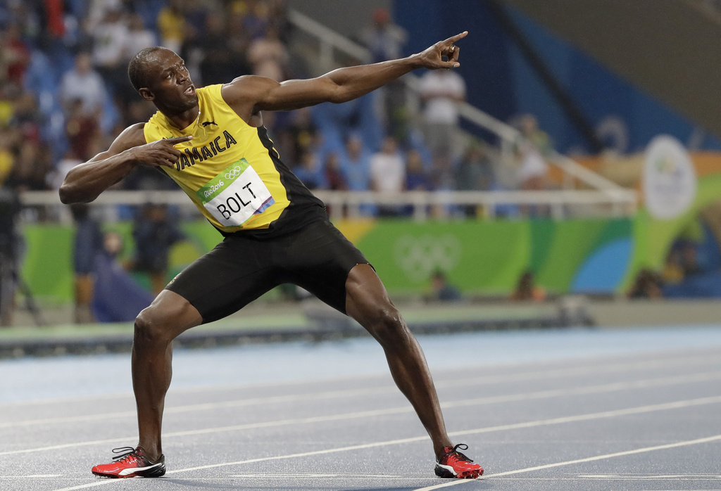 FILE - Usain Bolt from Jamaica celebrates winning the gold medal in the men's 200-meter final during the athletics competitions of the 2016 Summer Olympics at the Olympic stadium in Rio de Janeiro, Brazil, Thursday, Aug. 18, 2016. (AP Photo/David J. Phillip, File)