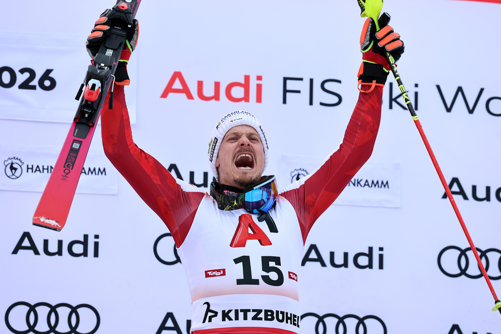 Austria's Manuel Feller celebrates winning an alpine ski, men's World Cup slalom in Kitzbuehel, Austria, Sunday, Jan. 25, 2026. (AP Photo/Marco Trovati)