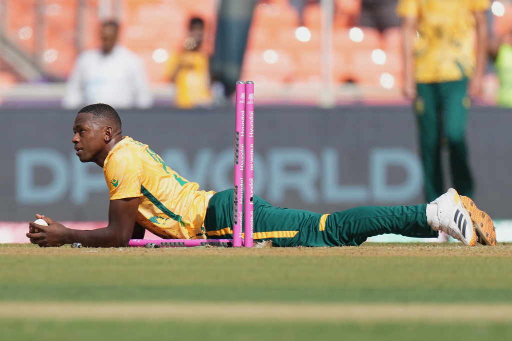 South Africa's Kagiso Rabada looks on with a ball as he run out Afghanistan's Fazalhaq Farooqi during the T20 World Cup cricket match between Afghanistan and South Africa in Ahmedabad, India, Wednesday, Feb. 11, 2026. (AP Photo/Ajit Solanki)