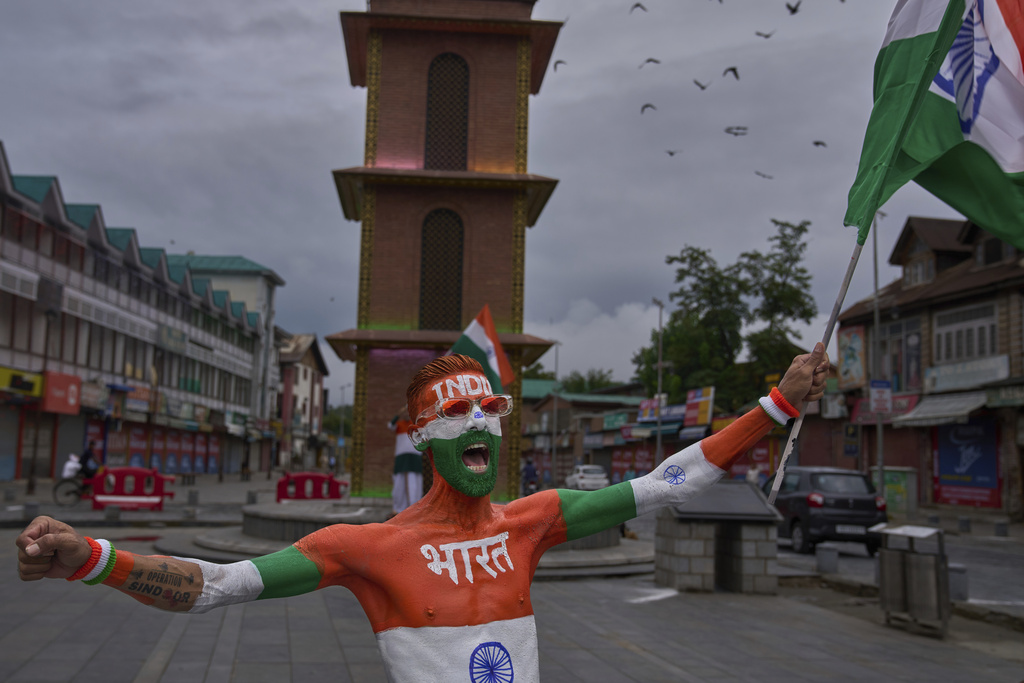 An Indian man painted with the Indian national flag shouts slogans as he celebrates India's Independence Day in Srinagar, Indian controlled Kashmir, Friday, Aug. 15, 2025. (AP Photo/Dar Yasin)
