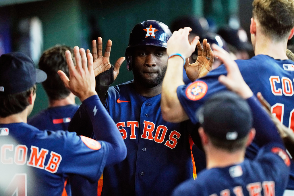 Houston Astros designated hitter Yordan Alvarez celebrates in the dugout after scoring during the sixth inning of a baseball game against the Seattle Mariners in Houston, Thursday, May 14, 2026. (AP Photo/Ashley Landis)