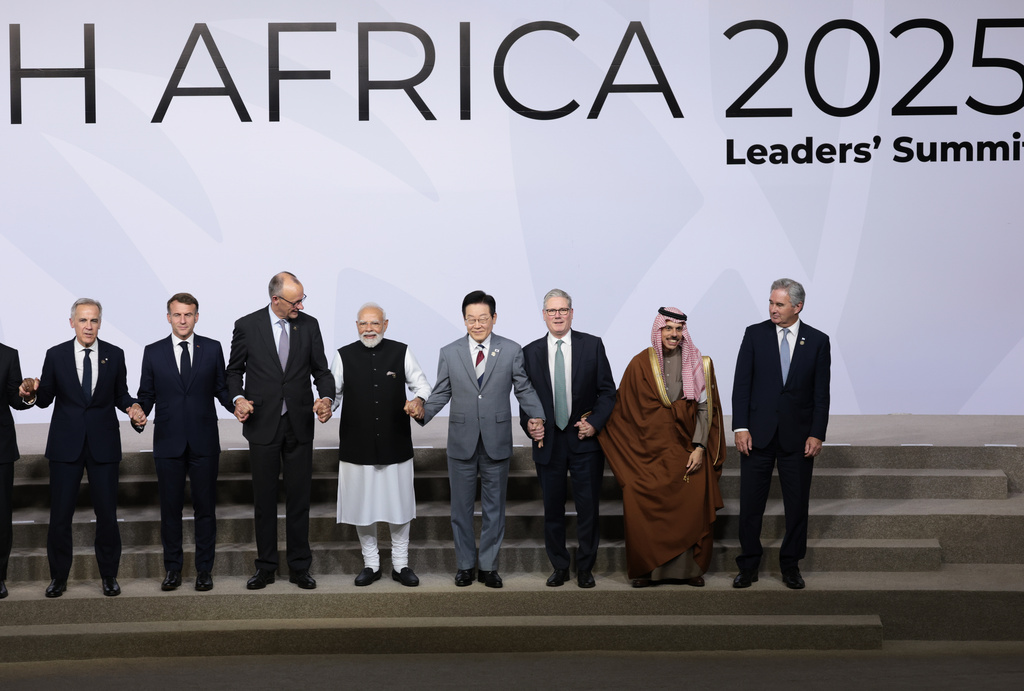 Leaders pose for a group photo, on the opening day of the G20 Leaders' Summit, in Johannesburg, South Africa, Saturday, Nov. 22, 2025. (Yves Herman/Pool Photo via AP)