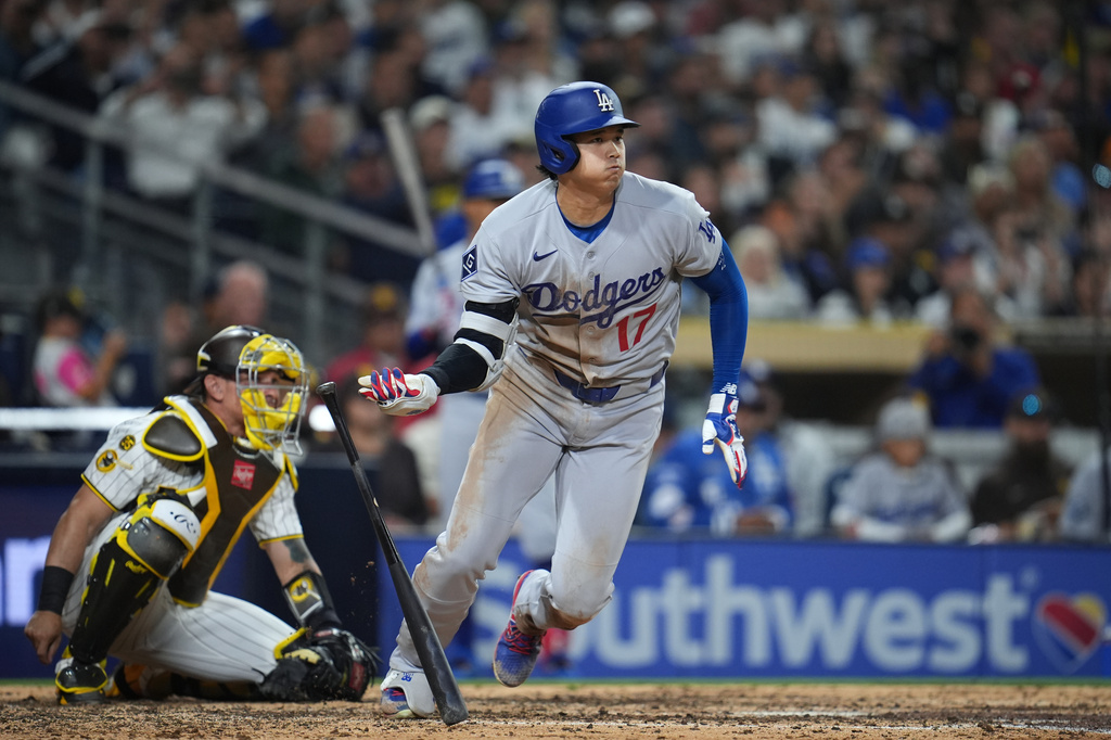 Los Angeles Dodgers' Shohei Ohtani watches his double during the eighth inning of a baseball game against the San Diego Padres Tuesday, May 19, 2026, in San Diego. (AP Photo/Gregory Bull)