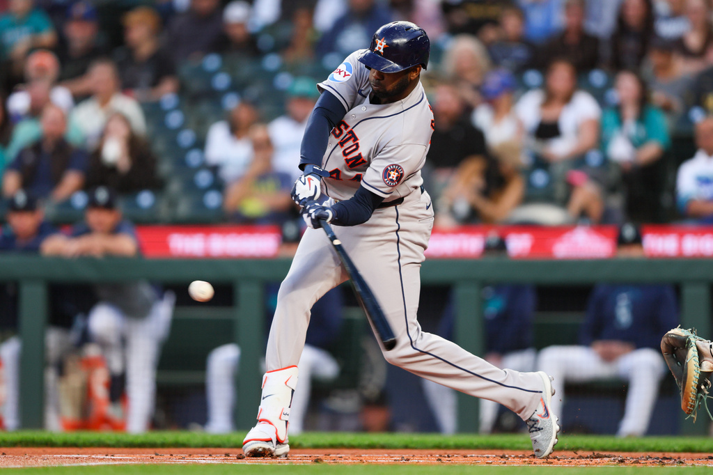 Houston Astros designated hitter Yordan Alvarez (44) hits an RBI single in the first inning of a baseball game against the Seattle Mariners, Tuesday, Sept. 22, 2026, in Seattle. (AP Photo/Kevin Ng)