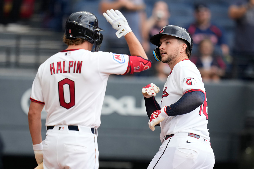 Cleveland Guardians' Patrick Bailey, right, celebrates with Petey Halpin (0) after hitting a home run in the third inning of a baseball game against the Arizona Diamondbacks in Cleveland, Sunday, Aug. 2, 2026. (AP Photo/Sue Ogrocki)