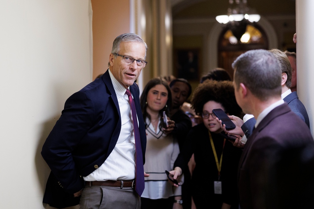 Sen. Majority Leader John Thune R-S.D., speaks to reporters outside his office on Capitol Hill on Friday, March 20, 2026, in Washington. (AP Photo/Tom Brenner)