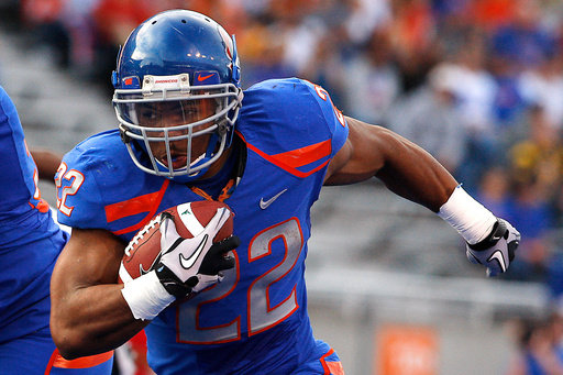 FILE - Boise State's doug Martin runs for a first down during the first half of the NCAA college football game against Toledo, Saturday, Oct. 9, 2010 in Boise, Idaho. (AP Photo/Matt Cilley, File) FILE - Boise State's doug Martin runs for a first down during the first half of the NCAA college football game against Toledo, Saturday, Oct. 9, 2010 in Boise, Idaho. (AP Photo/Matt Cilley, File)