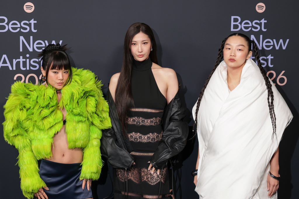 From left, Rei Ami, EJAE, and Audrey Nuna of HUNTR/X arrive at the Spotify Best New Artist Party on Thursday, Jan. 29, 2026, in Los Angeles. (Photo by Andrew Park/Invision/AP)