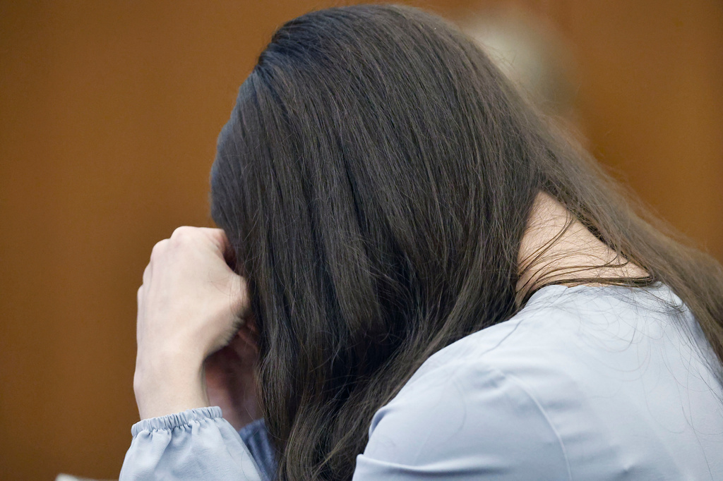 Lindsay Clancy hides her face as details of the murder of her children are spoken in court by her attorney Kevin Reddington during her murder trial at Plymouth Superior Court in Plymouth, Mass., Thursday, Aug. 27, 2026. (Greg Derr/The Patriot Ledger via AP, Pool)