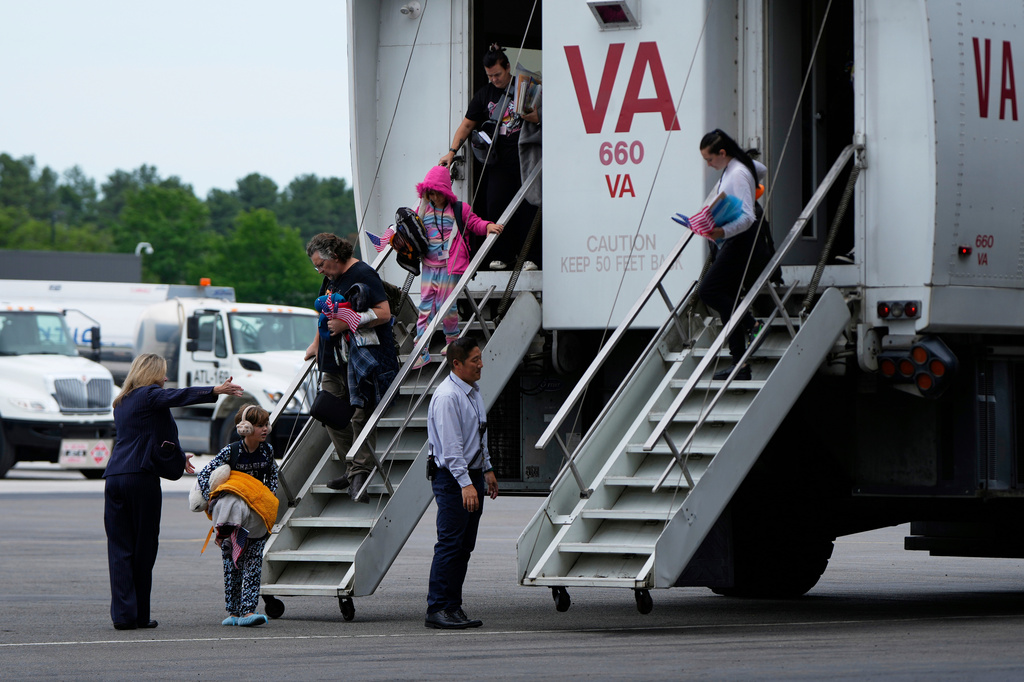 FILE - Afrikaner refugees from South Africa, arrive May 12, 2025, at Dulles International Airport in Dulles, Va. (AP Photo/Julia Demaree Nikhinson, File)