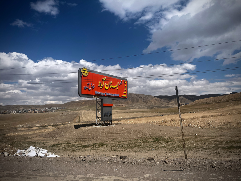 A welcome sign greets visitors on Road 16, outside the town of Bostanabad, Iran, Thursday, April 9, 2026. (AP Photo/Francisco Seco)