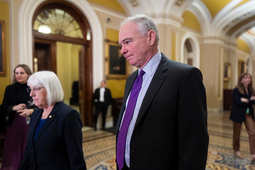 Sen. Tim Kaine, D-Va., center, and Sen. Patty Murray, D-Wash., left, arrive to speak with reporters at the Capitol in Washington, Tuesday, March 3, 2026. Kaine is leading an effort to advance a swift vote on a war powers resolution that would restrain President Donald Trump's military attack on Iran. (AP Photo/J. Scott Applewhite)