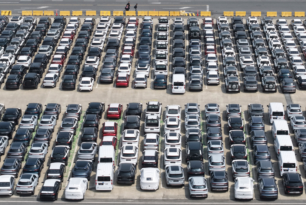 Aerial view of new vehicles waiting for shipment to overseas market at a port in Shanghai, China Saturday, May 9, 2026.(Chinatopix via AP)