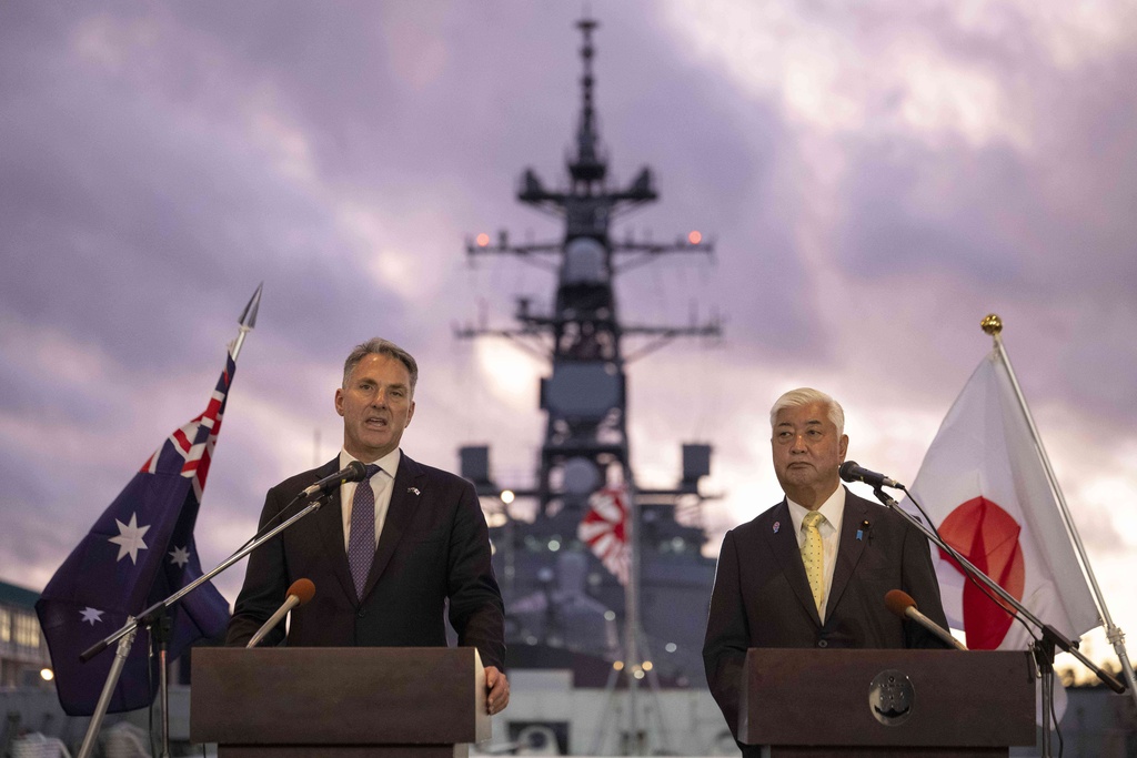 Japan's Defence Minister Gen Nakatani, right, and Australia's Defence Minister Richard Marles hold a joint press announcement aboard the Japan Maritime Self-Defense Force (JMSDF) Mogami-class stealth frigate JS Mikuma at the JMSDF naval base in Yokosuka, Japan, Friday Sept. 5, 2025. (Yuichi Yamazaki/Pool Photo via AP)